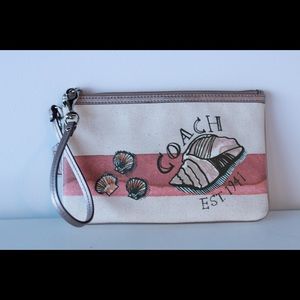 Cute Coach wristlet with beach seashell design